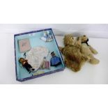 A mixed lot to include a vintage blonde plush teddy bear, a monkey hand puppet, a porcelain dolly