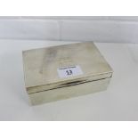 George V silver cigarette box with engine turned decoration and hinged lid with a cedar lining,