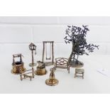 A collection of Edinburgh silver miniature models to include a water well, sundial, anvil, garden