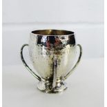 George V Irish silver egg cup with three loop handles and hammered finish to the body with makers