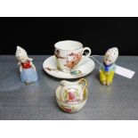 A mixed lot to include a nursery ware cup and saucer and a pair of Dutch boy and girl cruets and a