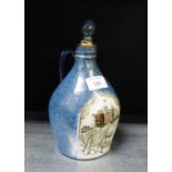 A Buchan stoneware jug and stopper with hand painted Edinburgh Castle scene, 23cm high