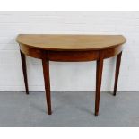 A mahogany d-end table on square tapering supports, 74 x 112cm