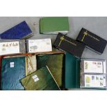 Six albums containing First Day Covers, together with a suitcase containing five albums of African