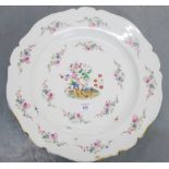 A large white glazed charger painted with floral sprays, 45cm diameter