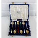 A harlequin set of six silver and enamel teaspoons, in fitted case, bearing makers mark for Henry