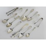 A collection of 19th and 20th century silver flatwares to include teaspoons, pickle forks, sugar