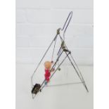 A vintage Japanese celluloid wind up acrobat toy, 39cm high