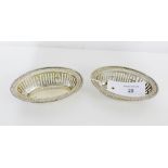 A pair of George VI silver bonbon dishes, each of oval form with beaded rims and pierced sides,