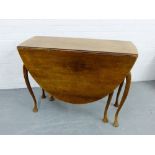 A drop leaf table on cabriole supports, 76 x 106cm