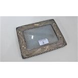 An Edwardian Art Nouveau silver photograph frame with makers mark for A & J Zimmerman, Birmingham