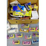 A carton containing a large collection of Matchbox and other model cars, mostly boxed together