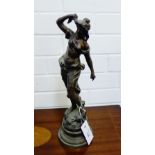 A Spelter figure of a female on circular base, 38cm high