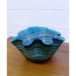 A green striped art glass bowl with frilled edge, 32cm wide