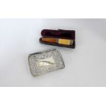 A Birmingham silver trinket dish together with a white metal mounted amber cheroot with leather