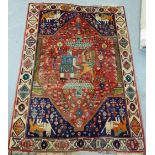 A Kashgai Persian King and Lion battle rug, 120 x 170cm