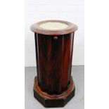 A 19th century mahogany cylindrical bedside, the circular top with a white marble inset on octagonal