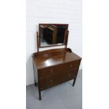 An Art Deco oak dressing table with two long drawers to the base