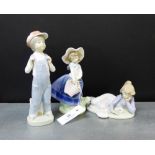 Three Lladro porcelain figures to include a girl and ducks, a boy in dungarees and a girl with a