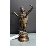 A bronze dancing figure on lotus base, 23cm high