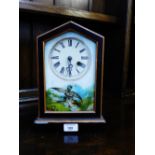 A mantle clock with enamel dial and painted glass door, 29cm high
