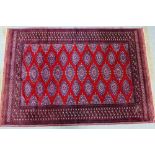 A Belouch style rug with red field, 200 x 125cm