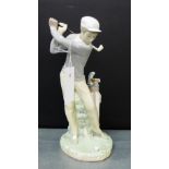 A Lladro porcelain figure of a Golfer in full swing, 29cm high
