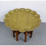A brass topped Benares style table, 62cm