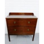 An oak Art Deco ledgeback chest with two long drawers