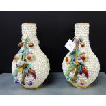 A pair of continental porcelain scheerblumen floral encrusted vases further enhanced with branch