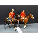 A Beswick horse model with a show jumper wearing in red jacket, together with another of a mounted