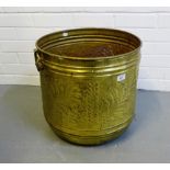 A large brass circular planter,
