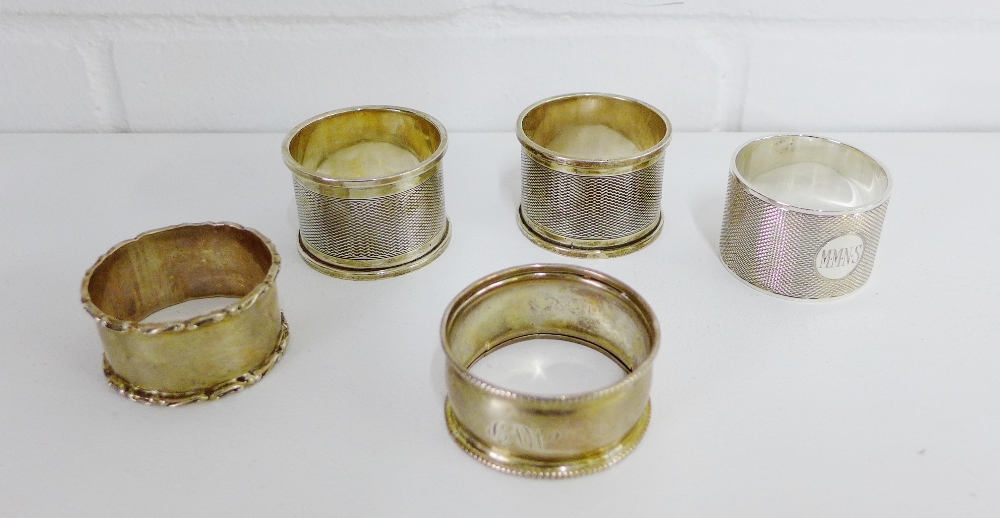 A collection of five silver napkin rings with various makers marks and date letters (5)