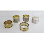 A collection of five silver napkin rings with various makers marks and date letters (5)