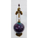 An American art pottery lamp with bronze mounts and mottled ceramic glazed body, the base