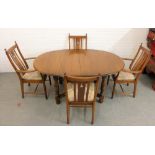 An Ercol dining suite comprising a set of four Shaker style chairs and a matching table, 75 x