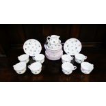 A Villeroy and Boch floral patterned tea set comprising eight cups, eight saucers, eight side