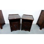 A pair of dark oak bedside cabinets with plant pot carved doors, 62 x 42cm (2)