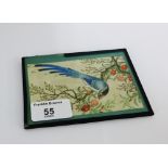 A small needlework and watercolour panel of a bird and foliage, in a glazed frame, 12.5 x 9cm
