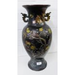 A Meiji Japanese bronze baluster vase with mythical beast handles to side, finely inlaid and