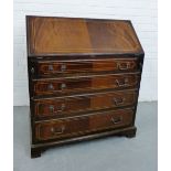 A mahogany and inlaid bureau, the fall front opening to reveal a fitted interior over pull out