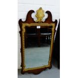 A Georgian style mahogany gilt wood wall mirror, 48 x 90cm