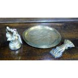 Brass wares to include a Middle Eastern style plate, Victorian paper hand clip and a bird weight (3)