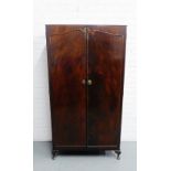 A vintage Beithcraft wardrobe, with panelled doors and cabriole supports 158 x 64cm