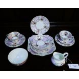 A Continental porcelain teaset comprising five cups, five saucers, five side plates, milk jug, sugar