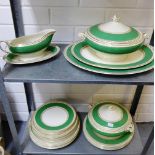 Crown Ducal table wares, the white ground with green band and gilt rims comprising dinner plates,