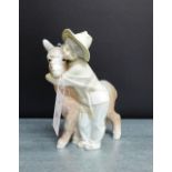 A Lladro porcelain figure of a boy and a donkey, 20cm high