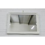 A contemporary white painted rectangular wall mirror, 75 x 106cm