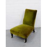 A nursing / low bedroom chair with green plush upholstery and turned ebonised supports, 52 x 48cm