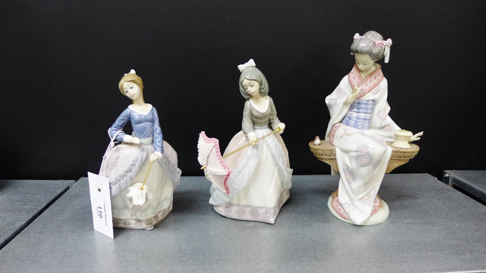 Three Lladro porcelain figures to include a Geisha girl (a/f), together with two smaller models of